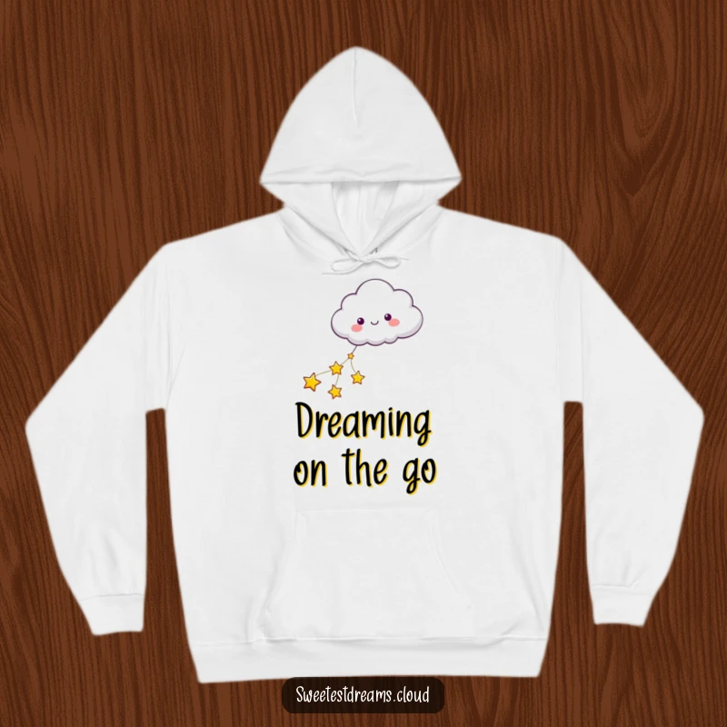 Funny hoodie depicting a cloud character being serenely pulled by a string of twinkling stars, embodying peaceful journeys.
