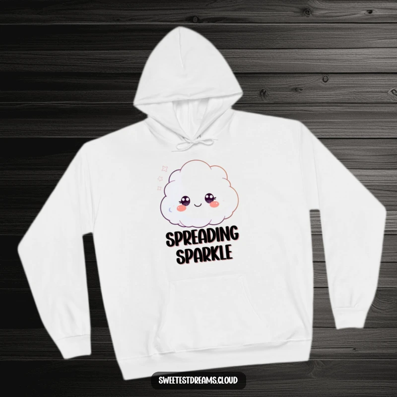 Funny hoodie showcasing a small, fluffy cloud character with bright, happy eyes, magically blowing a shower of glittering particles.